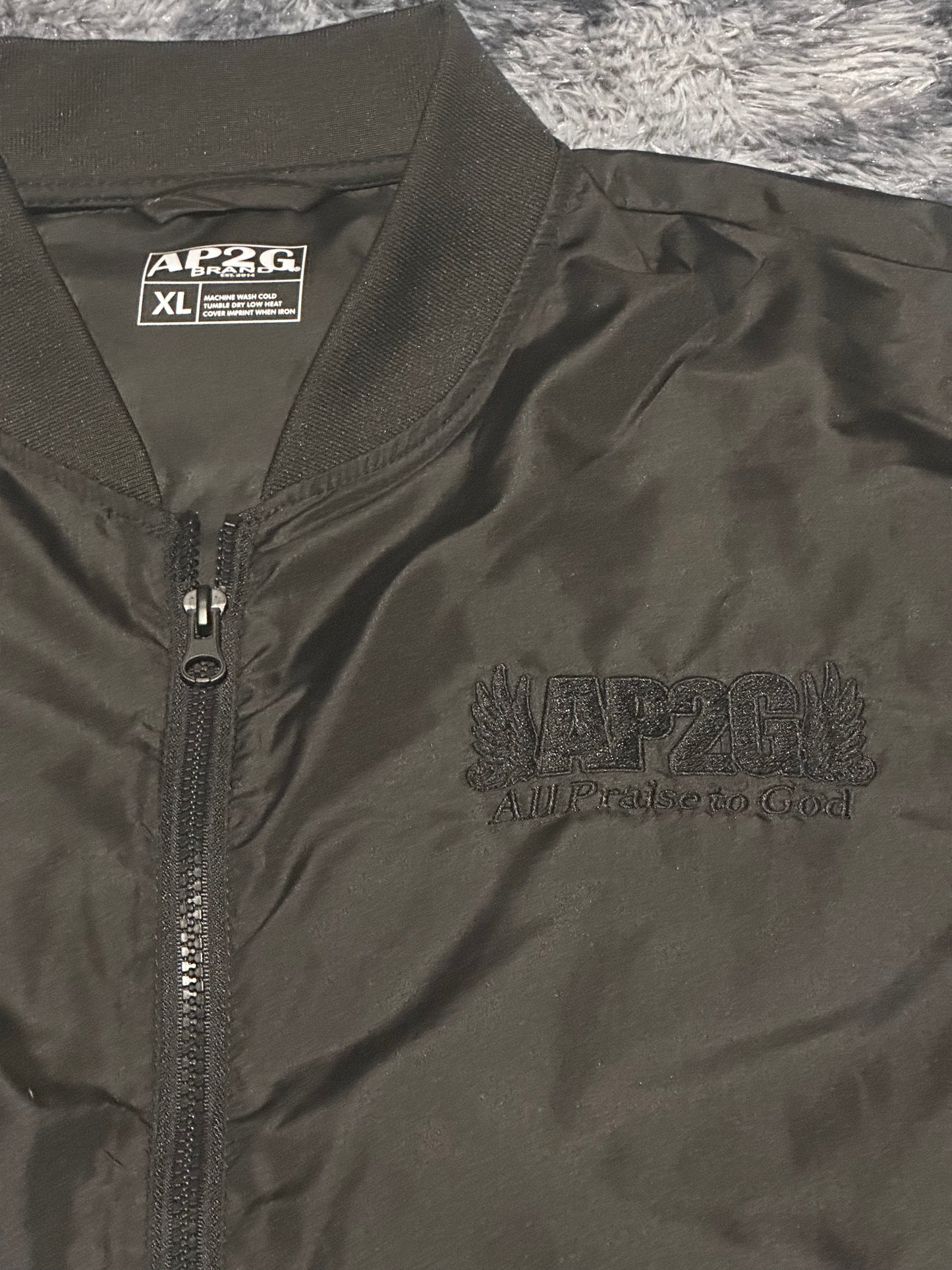 AP2G Praise Wing Bumper Jacket – Blackout Edition